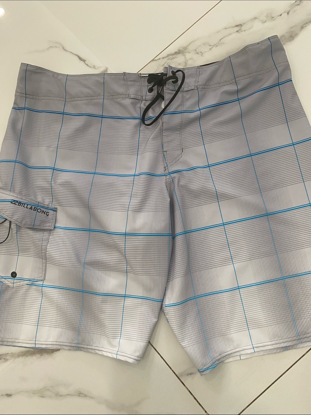 Billabong Men’s Light Gray Boardshorts with Blue Grid Lines